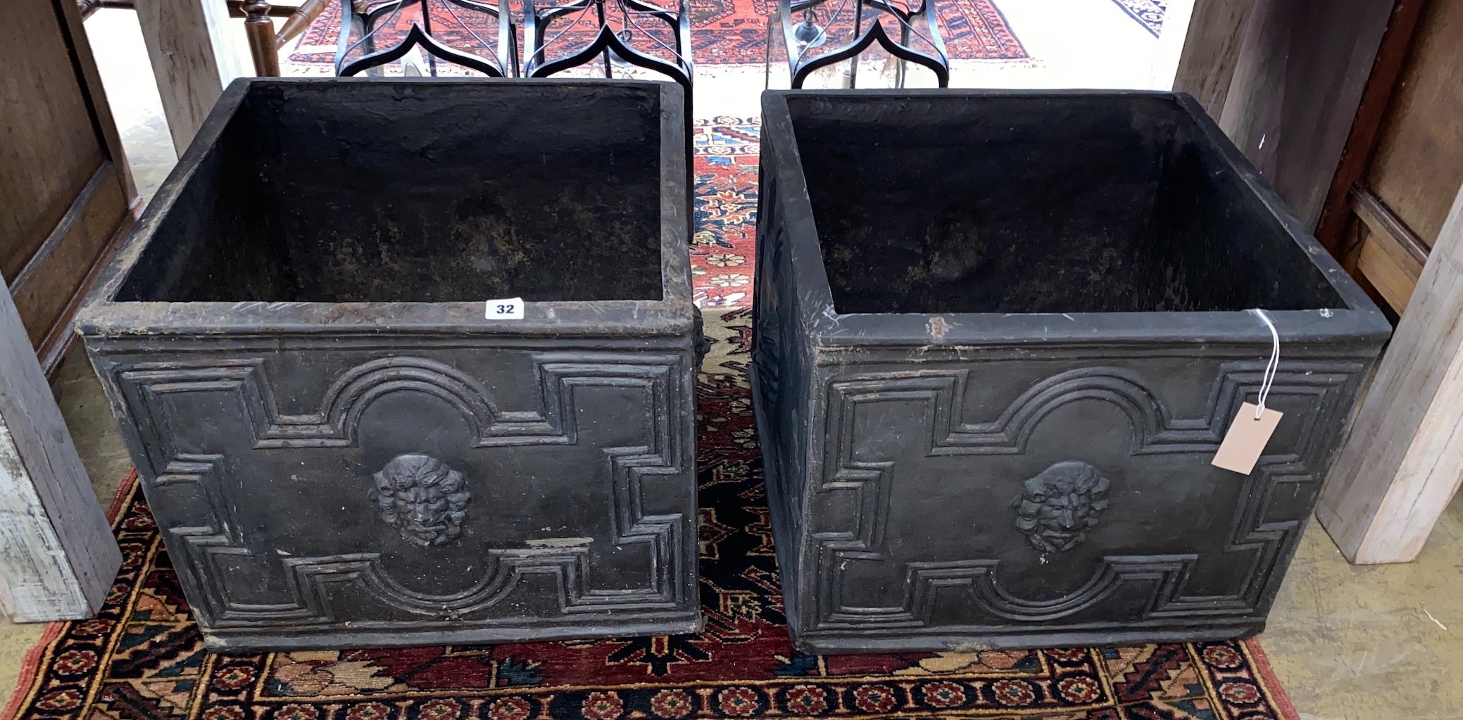 A pair of square fibreglass faux lead planters, 50cm, height 40cm